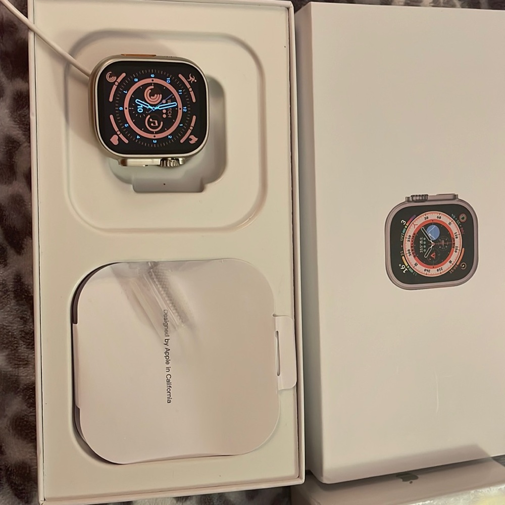 Ultra titanium case orange ocean band Apple Watch . Brand new . Never used .